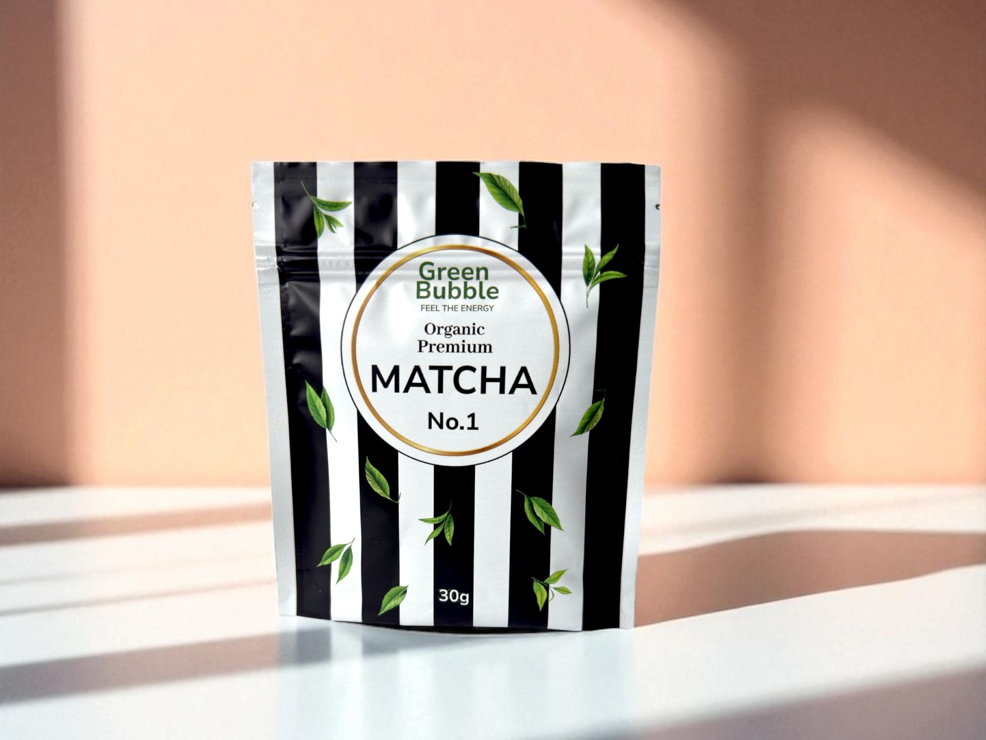 Green Bubble matcha packaging with black and white striped design on a light background