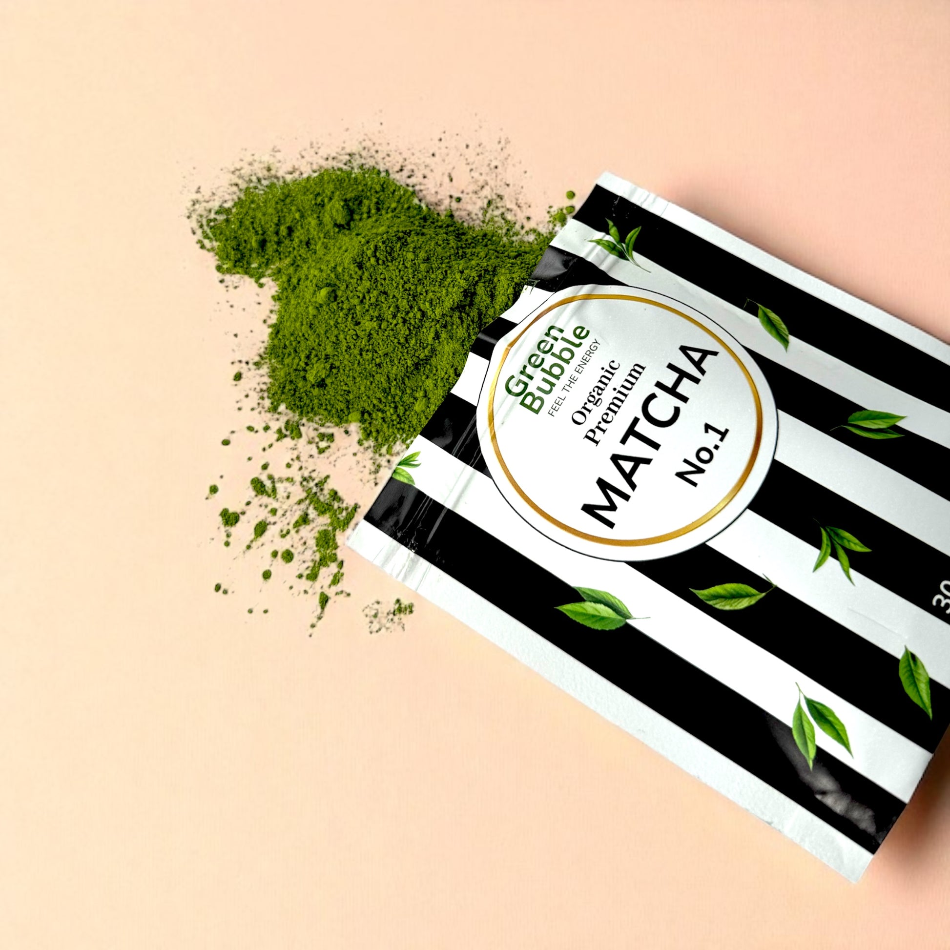Packaging of Green Bubble Premium Matcha No.1 with matcha powder on a beige background