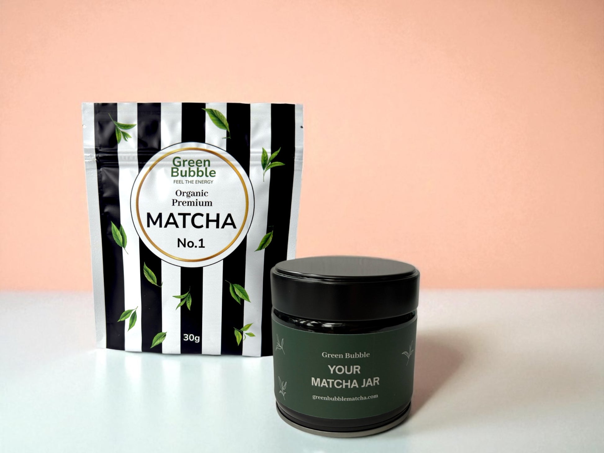 Green Bubble matcha packaging and jar on a light pink background