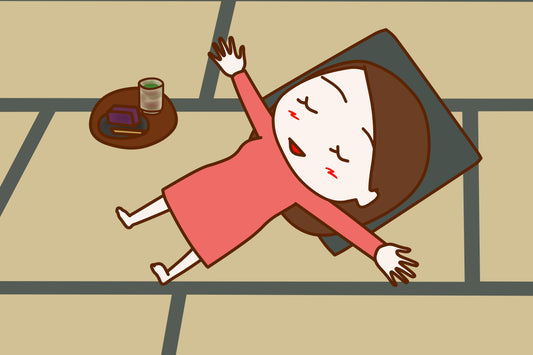 A mum is lying on the floor-exhausted, but happy, because she is having her matcha